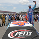 Bubba Wallace takes a selfie with NASCAR drivers standing behind in support prior to start of Geico 500 at Talladega on Monday.